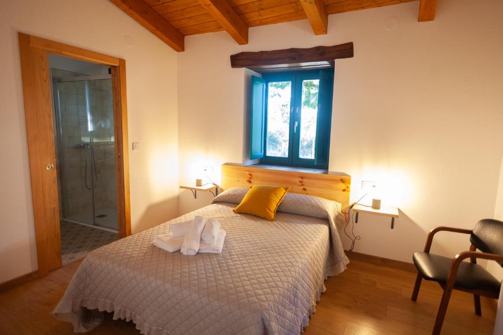 Postel nebo postele na pokoji v ubytování CASA TERRA ALMA