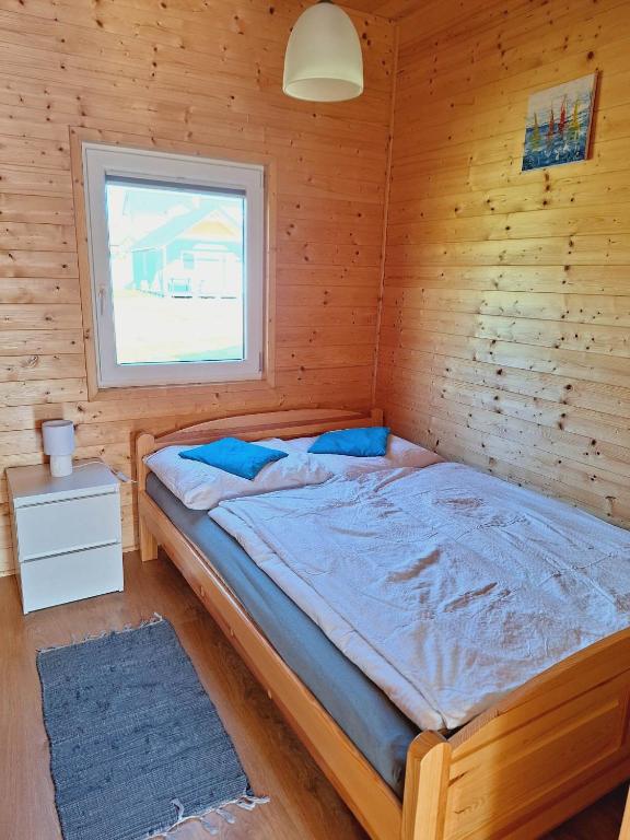 Postel nebo postele na pokoji v ubytování MożeMorze? Ośrodek Domków Letniskowych