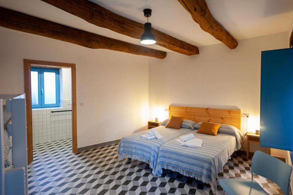Postel nebo postele na pokoji v ubytování CASA TERRA ALMA