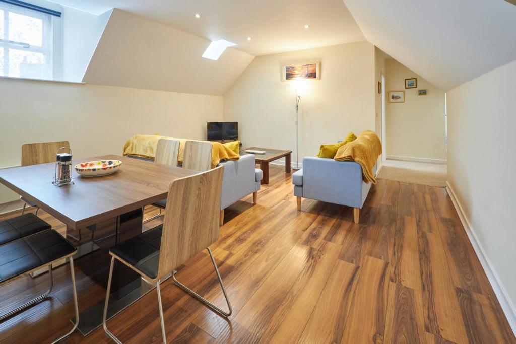 a dining room and living room with a table and chairs at Host & Stay - Scotsgate House in Berwick-Upon-Tweed