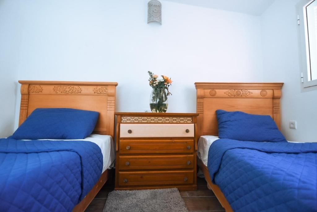 Postel nebo postele na pokoji v ubytování Riad Nakhla
