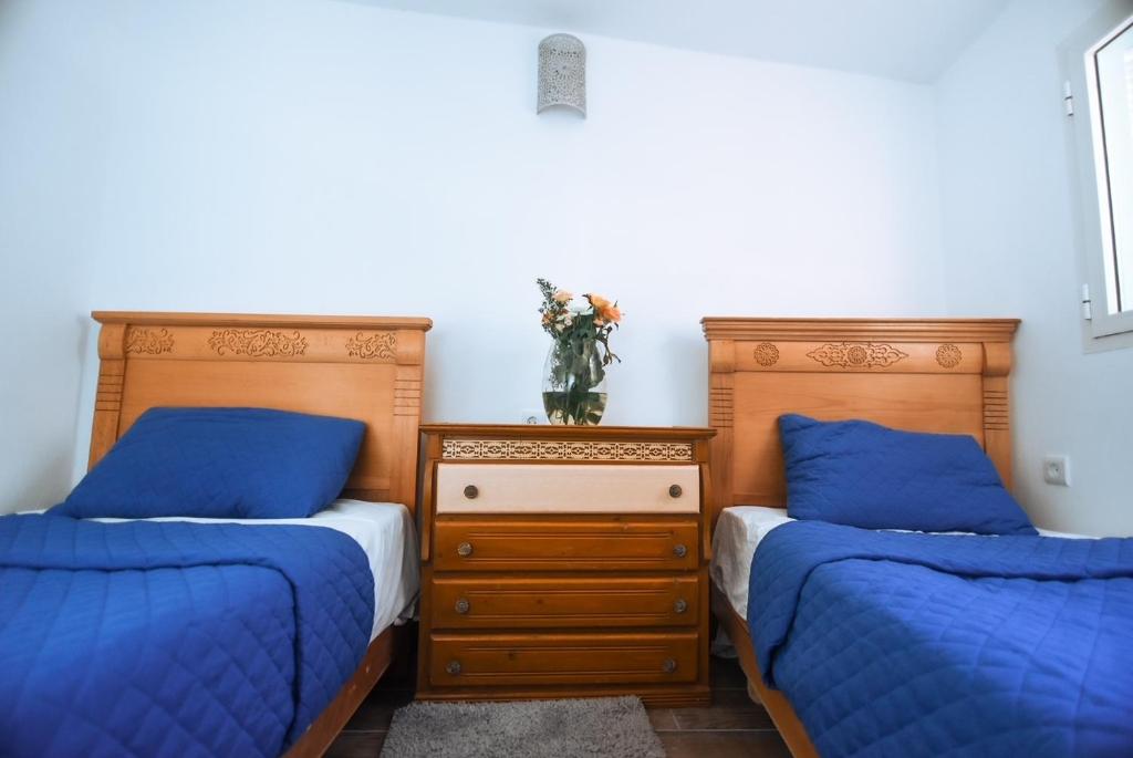 Postel nebo postele na pokoji v ubytování Riad Nakhla