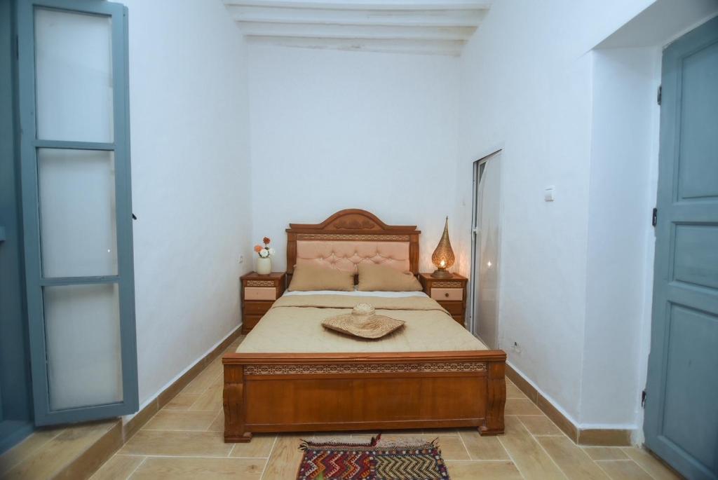 Postel nebo postele na pokoji v ubytování Riad Nakhla