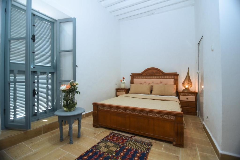 Postel nebo postele na pokoji v ubytování Riad Nakhla