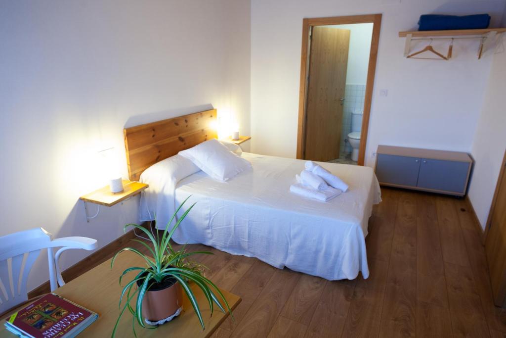Postel nebo postele na pokoji v ubytování CASA TERRA ALMA