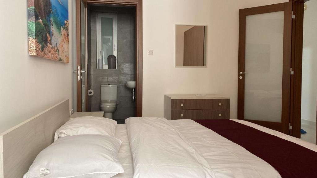 Postel nebo postele na pokoji v ubytování Sunrise Court