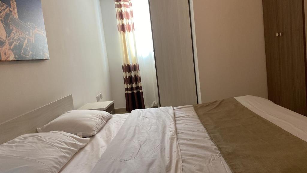 Postel nebo postele na pokoji v ubytování Sunrise Court