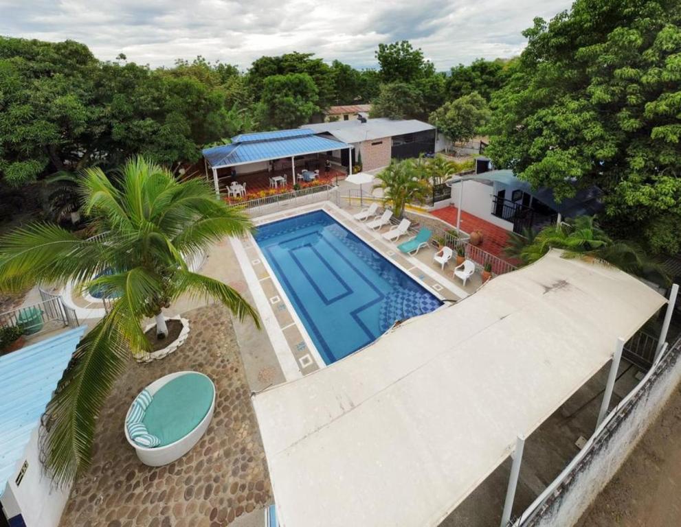 an overhead view of a swimming pool with a resort at EL CIELO By Ruby in La Victoria