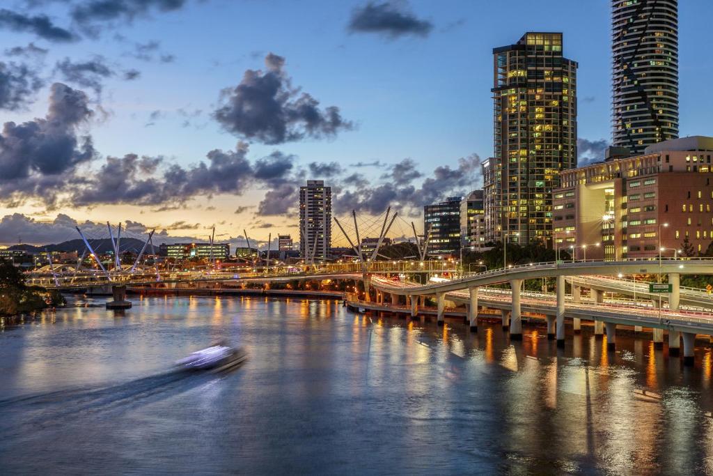 a large body of water with a city skyline at Evolution Apartments in Brisbane