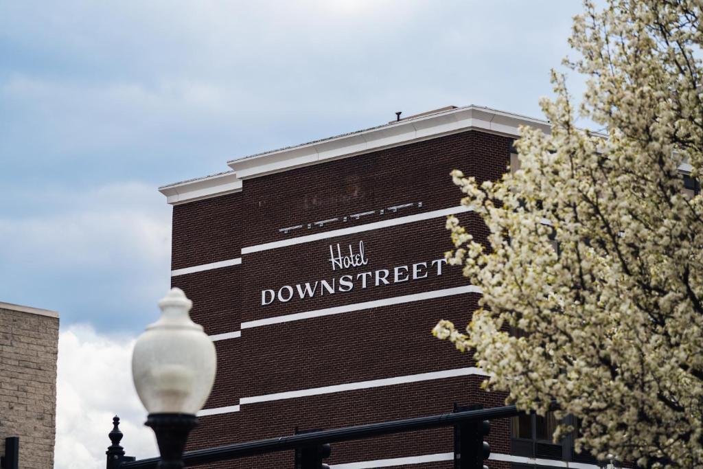 a building with a sign on the side of it at Hotel Downstreet in North Adams