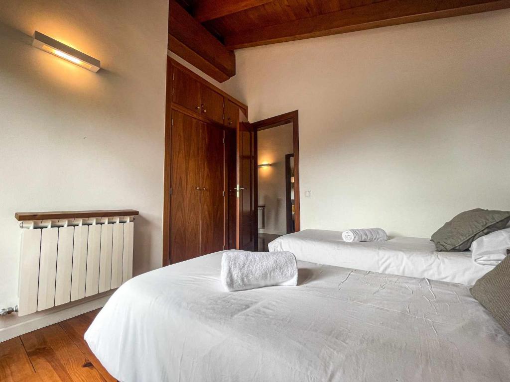 Posteľ alebo postele v izbe v ubytovaní Cal Peró Casa de montaña