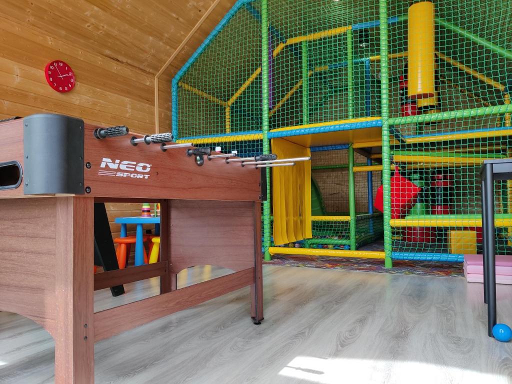 a play area with a bird cage in a room at Osada Jantar-Resort&SPA in Jantar