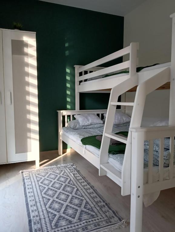 Posteľ alebo postele v izbe v ubytovaní Domek letniskowy Sunny House , Nocleg Zator Energylandia