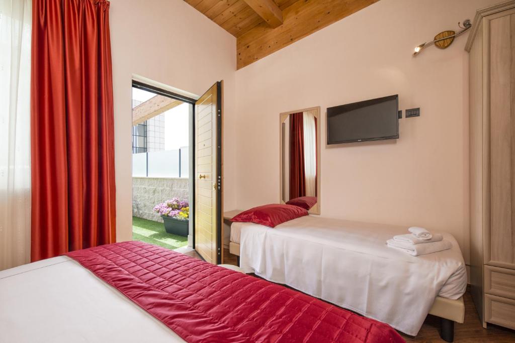 Postel nebo postele na pokoji v ubytování Simon Hotel