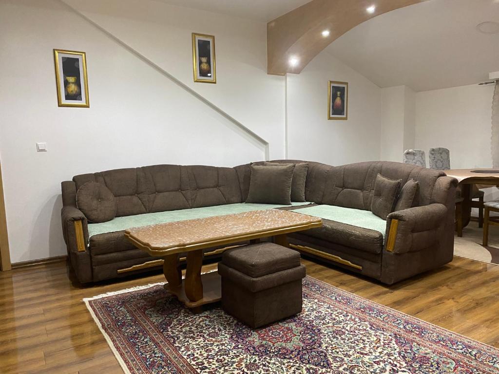 a living room with a couch and a table at Apartment Poturmahala in Travnik