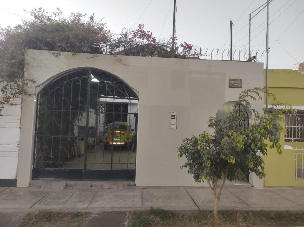 a yellow bus is coming out of a building at CasaBlanca in Nazca