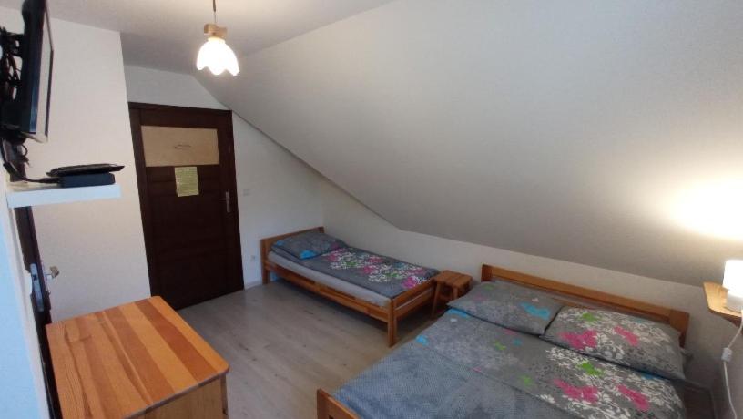 Postel nebo postele na pokoji v ubytování Noclegi u Bartka