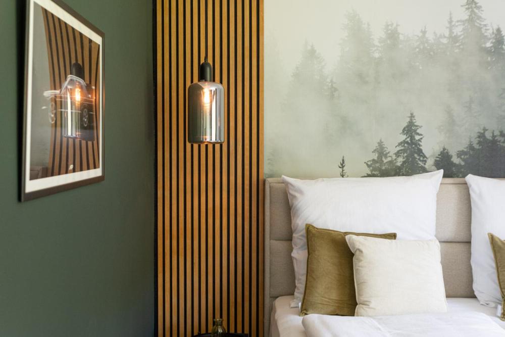 Postel nebo postele na pokoji v ubytování Hotel Zweite Heimat Nürburg