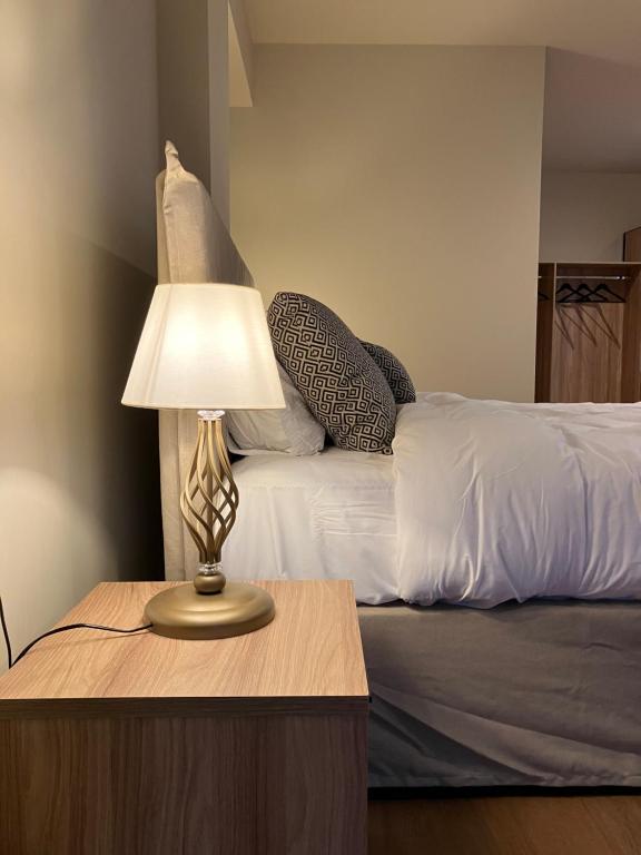Postel nebo postele na pokoji v ubytování Melofegaro Guesthouse