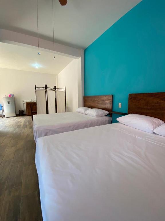 Postel nebo postele na pokoji v ubytování Casa Suites Minizoo