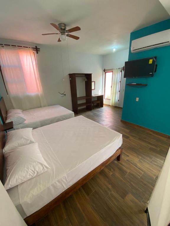 Postel nebo postele na pokoji v ubytování Casa Suites Minizoo