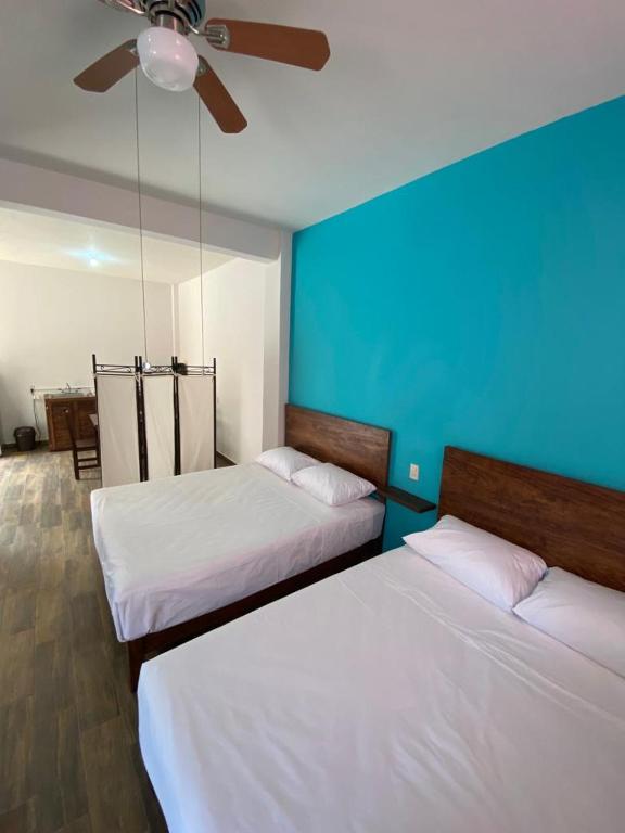 Postel nebo postele na pokoji v ubytování Casa Suites Minizoo