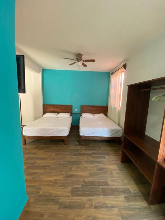 Postel nebo postele na pokoji v ubytování Casa Suites Minizoo