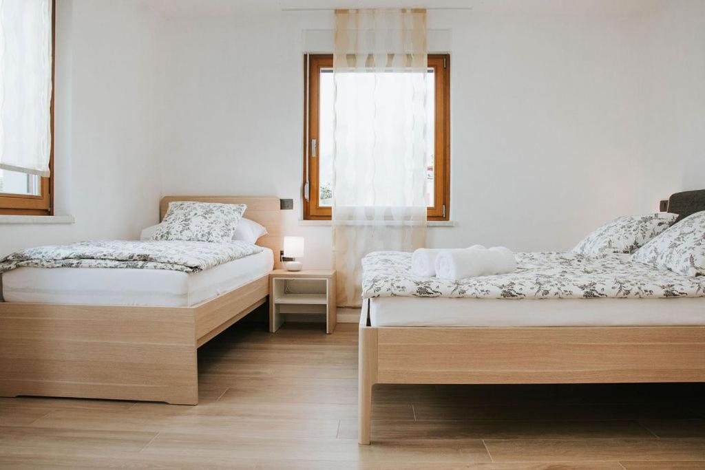Postel nebo postele na pokoji v ubytování Apartmaji URŠIČ