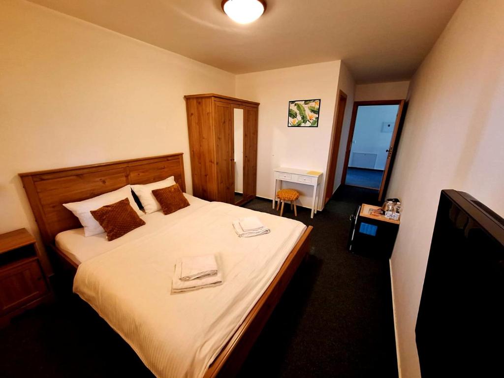 Postel nebo postele na pokoji v ubytování Vila Fenix B&B