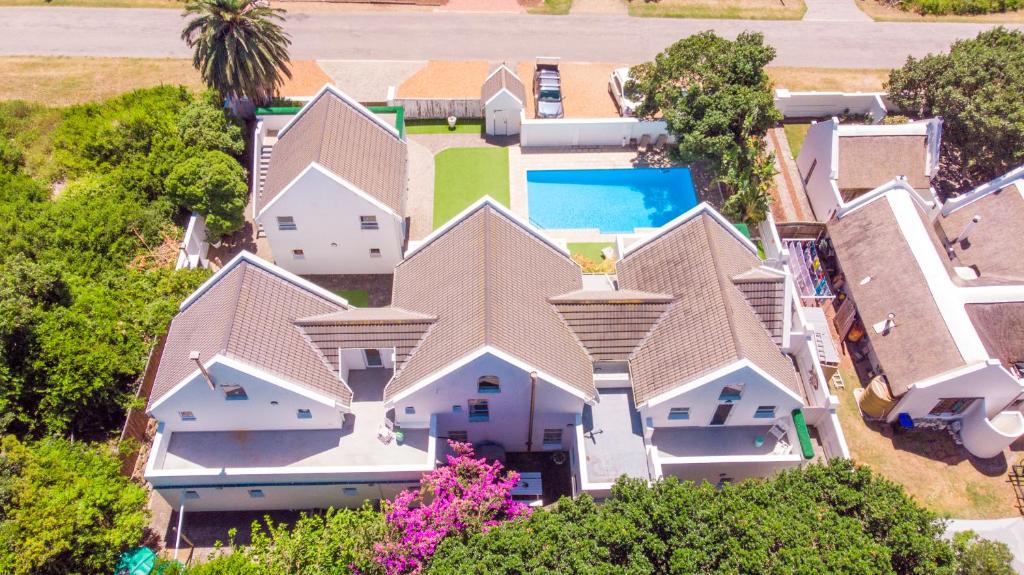 an aerial view of a house with a swimming pool at Adrift Guesthouse St Francis Bay in St Francis Bay