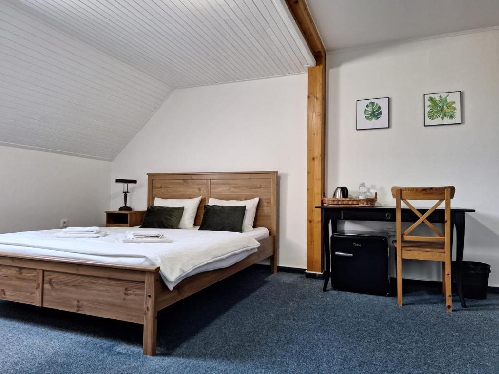 Postel nebo postele na pokoji v ubytování Vila Fenix B&B