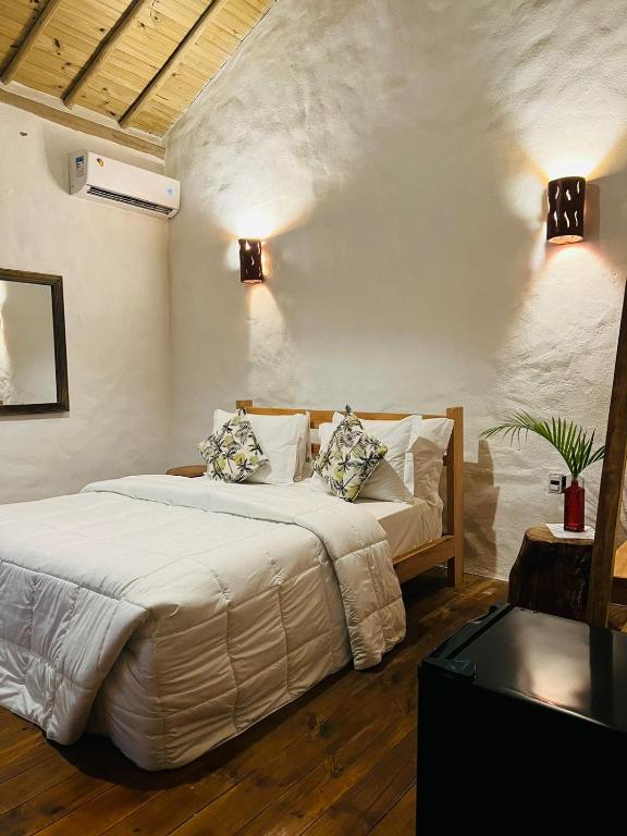 Postel nebo postele na pokoji v ubytování Villa Sagui Trancoso