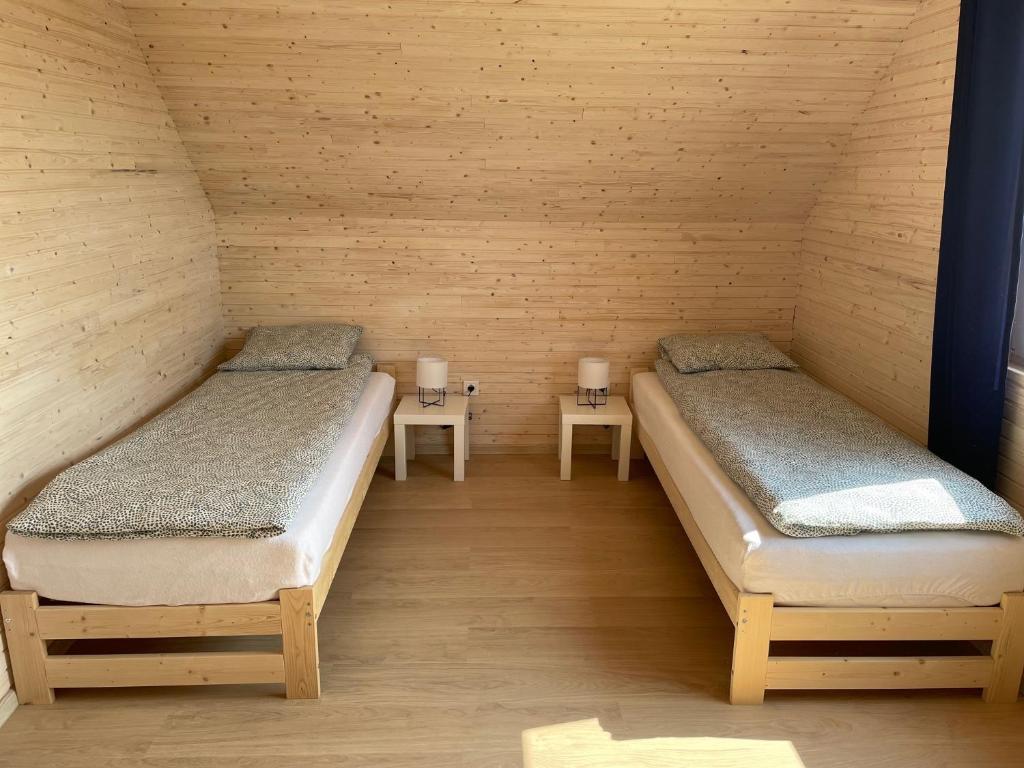 Postel nebo postele na pokoji v ubytování PoProstuDomki