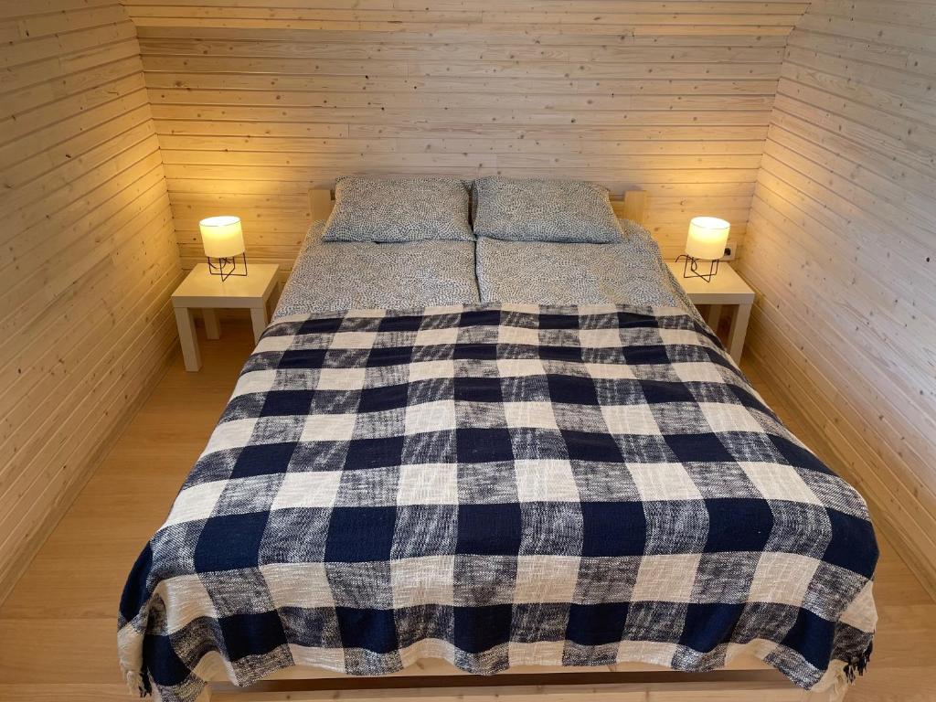 Postel nebo postele na pokoji v ubytování PoProstuDomki