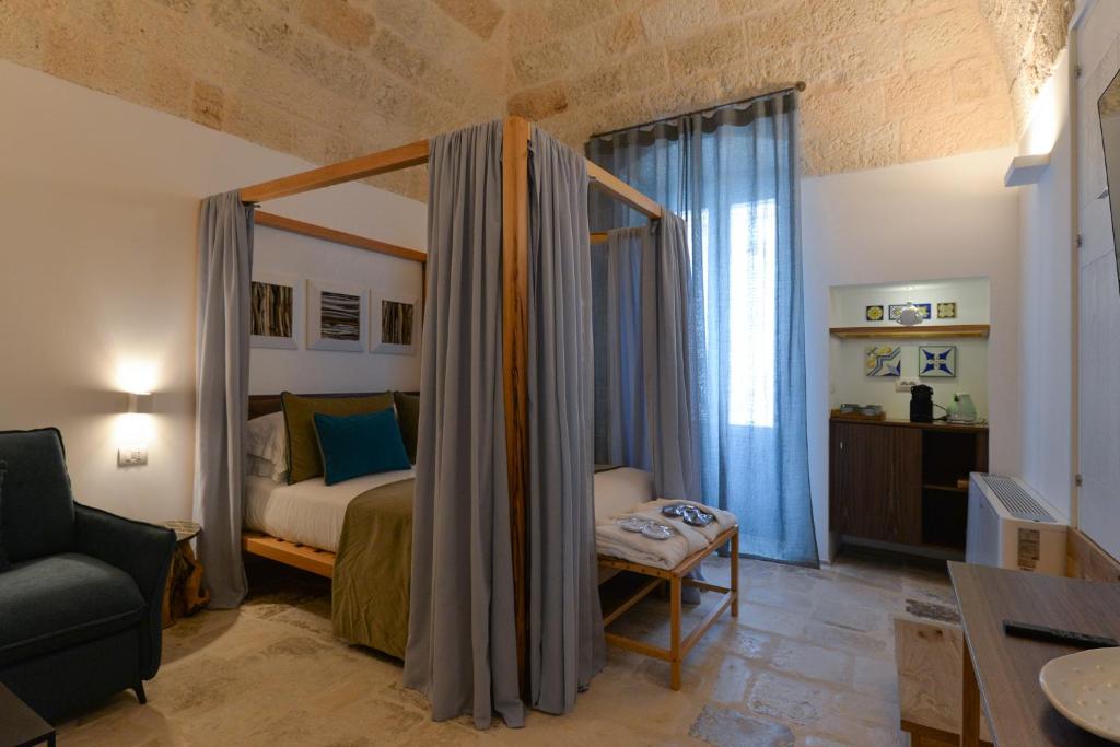 Postel nebo postele na pokoji v ubytování B-Welcome Rooms of Charme e Relax