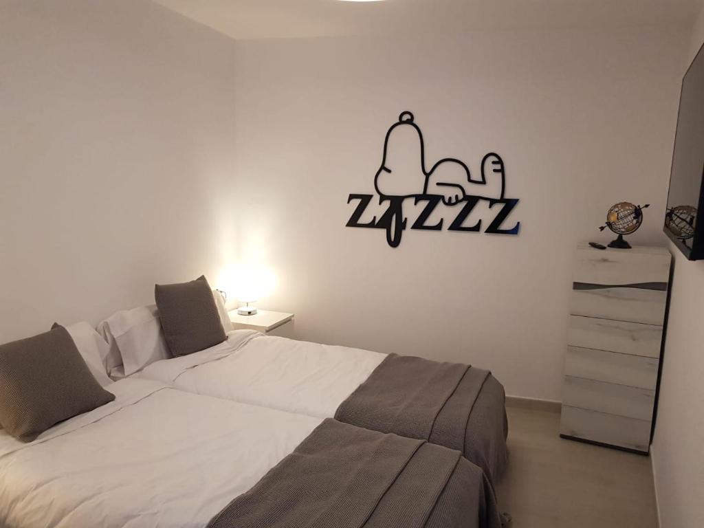Postel nebo postele na pokoji v ubytování APARTAMENTS L’ARC