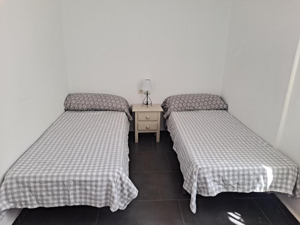 Postel nebo postele na pokoji v ubytování Ático con terraza