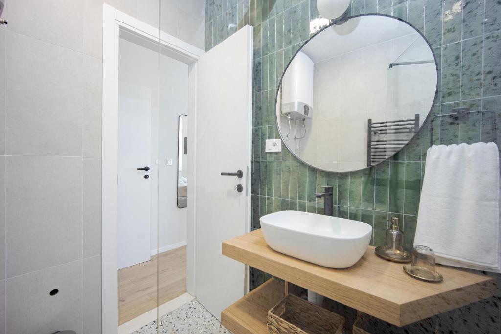 a bathroom with a sink and a mirror at Luxury Rooms Zara&Ane in Split