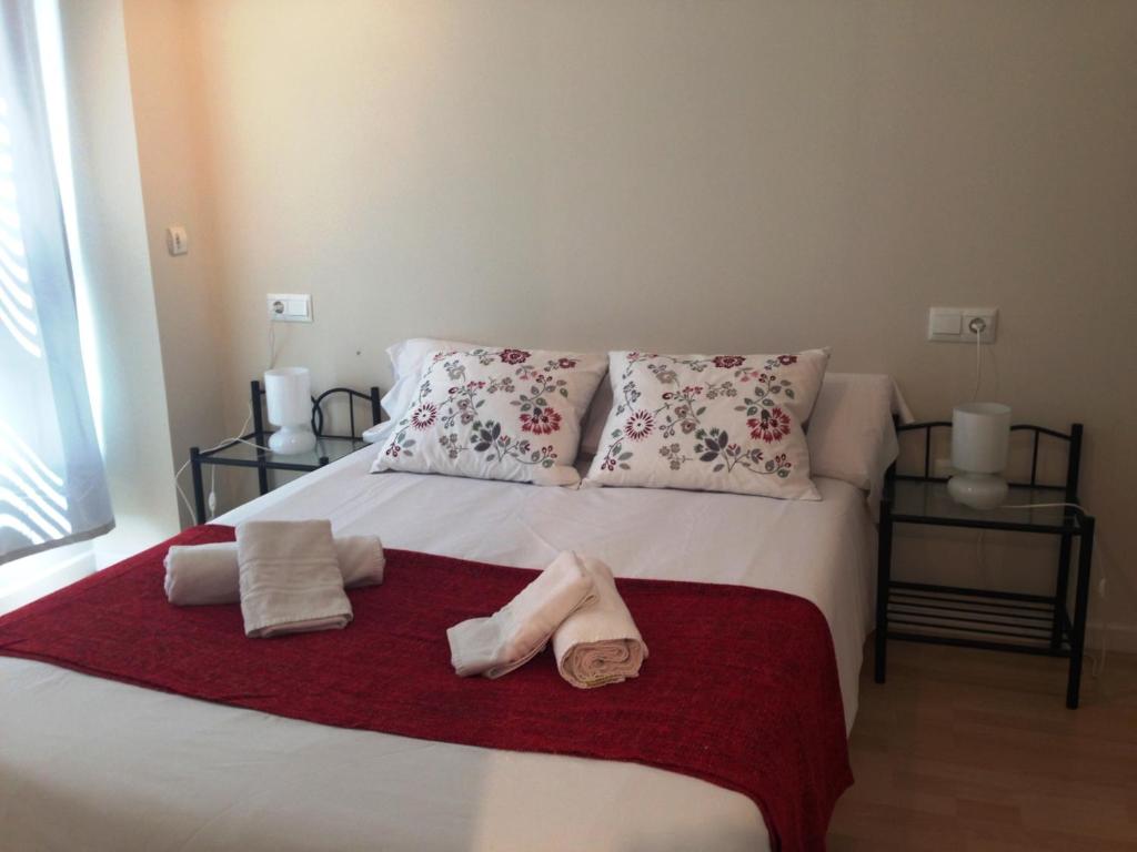 Posteľ alebo postele v izbe v ubytovaní Apartaments Muntaner I