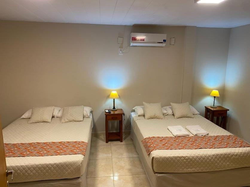 Postel nebo postele na pokoji v ubytování Hotel Yvy Pyta