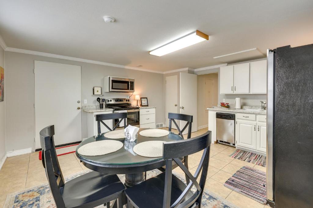 a kitchen and dining room with a table and chairs at Fayetteville Condo about 2 Blocks to Dickson Street! in Fayetteville