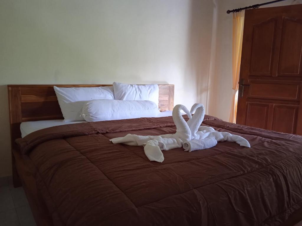 Postel nebo postele na pokoji v ubytování Yeh Ning Guest House