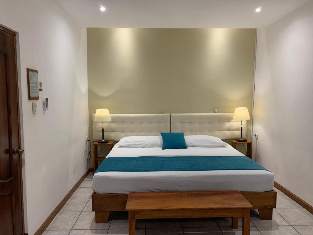 Postel nebo postele na pokoji v ubytování Casa D´Cristhi