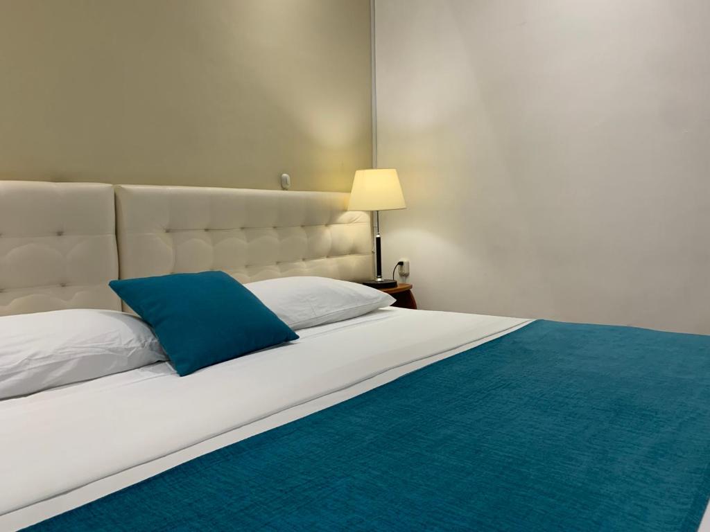 Postel nebo postele na pokoji v ubytování Casa D´Cristhi