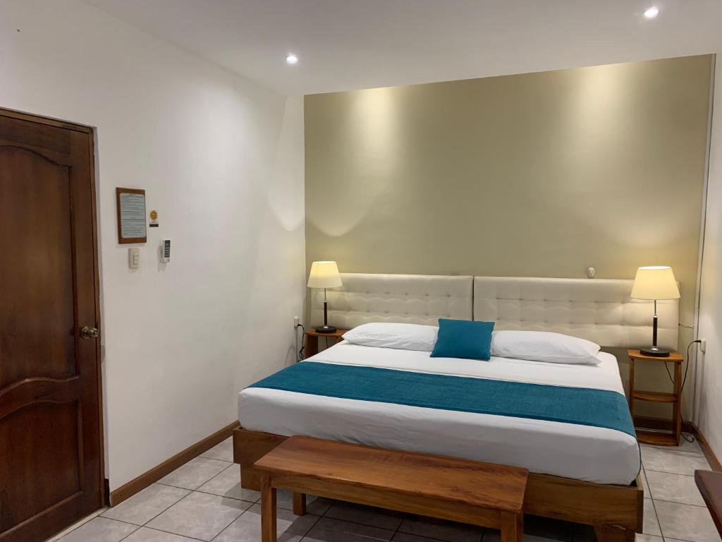 Postel nebo postele na pokoji v ubytování Casa D´Cristhi