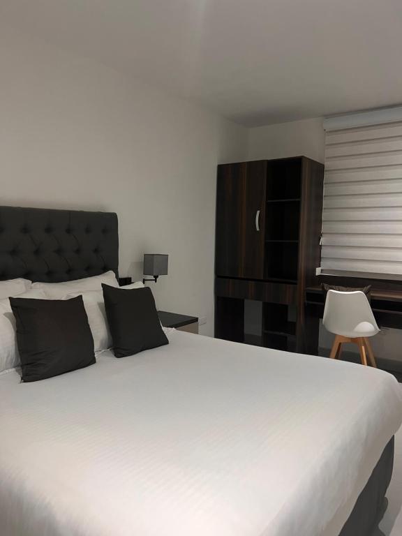 Postel nebo postele na pokoji v ubytování Hotel Zuriel Boutique