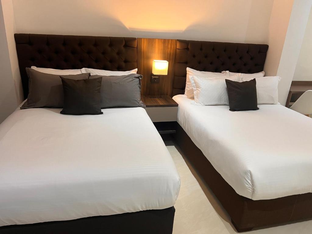 Postel nebo postele na pokoji v ubytování Hotel Zuriel Boutique