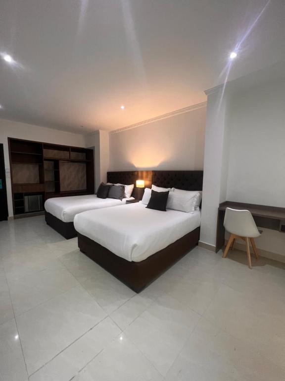 Postel nebo postele na pokoji v ubytování Hotel Zuriel Boutique