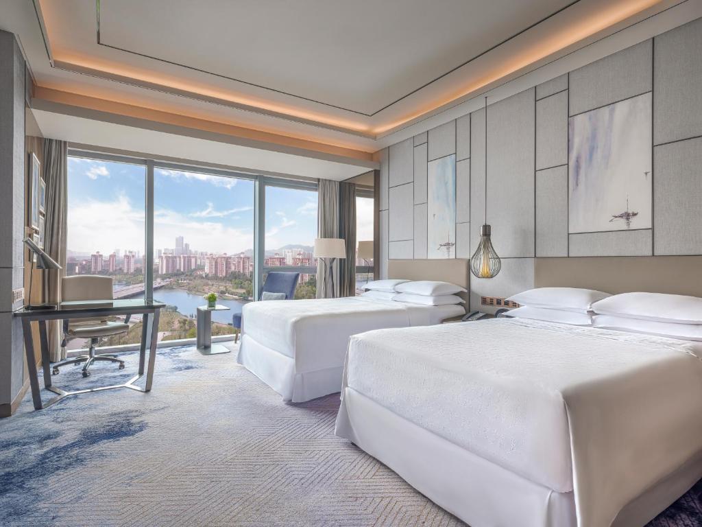 Postel nebo postele na pokoji v ubytování Sheraton Guangzhou Nansha Hotel