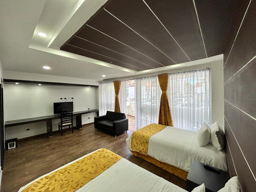 Postel nebo postele na pokoji v ubytování Hotel Palermo Suite